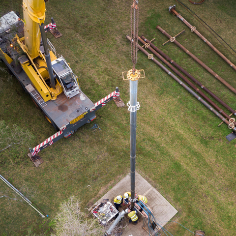 Crane operating near water piping and infrastructure