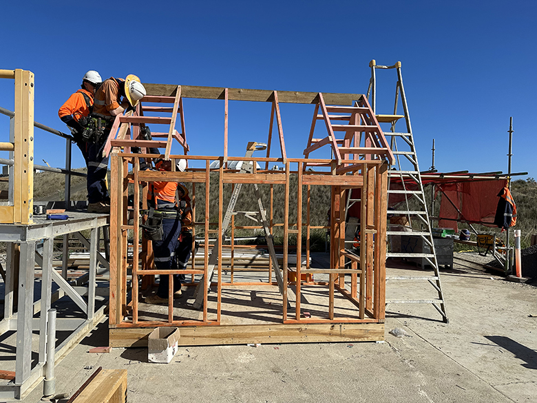 Contruction workers building a cubbyhouse.