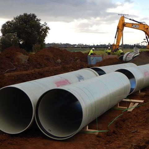 Pipes, workers and crane.