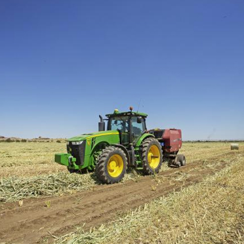 Tractor on dry farmland.