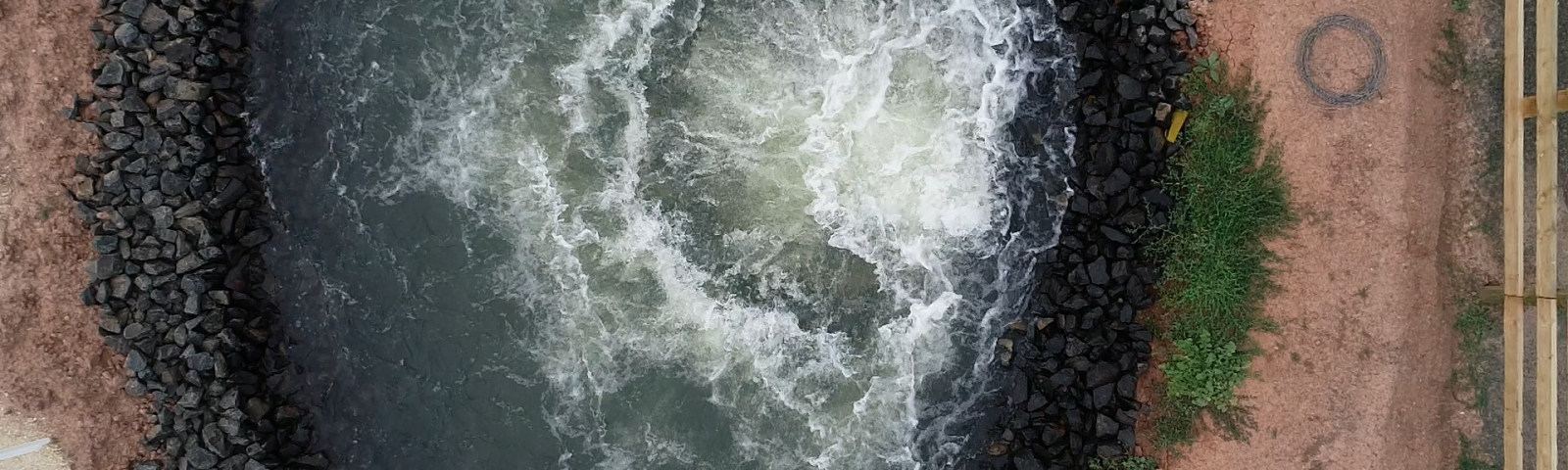 Overhead view of water coming out of pipeline at Macalister Irrigation District in Victoria