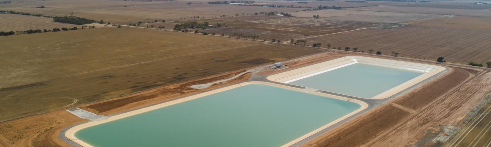 Aerial view of the Northern Adelaide Irrigation Scheme in South Australia. Two holding ponds on a plain
