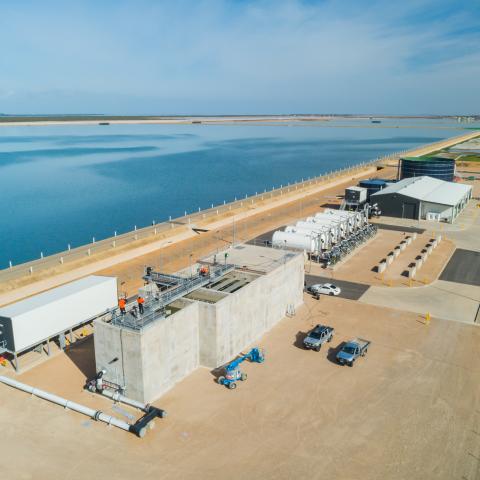 Aerial view of the Northern Adelaide Irrigation Scheme in South Australia, pondage in the upper left corner, buildings and infrastructure in the lower right corner