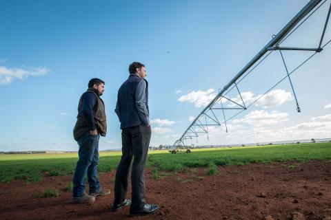 Western Water staff and farmer with pivot irrigator in the Parwan area of the Western Irrigation Network in Victoria