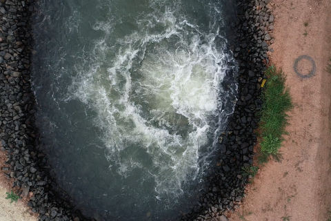 Overhead view of water coming out of pipeline at Macalister Irrigation District in Victoria