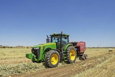Tractor on dry farmland.